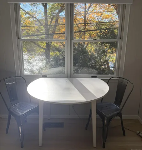 a view of a dining room with furniture window and outside view