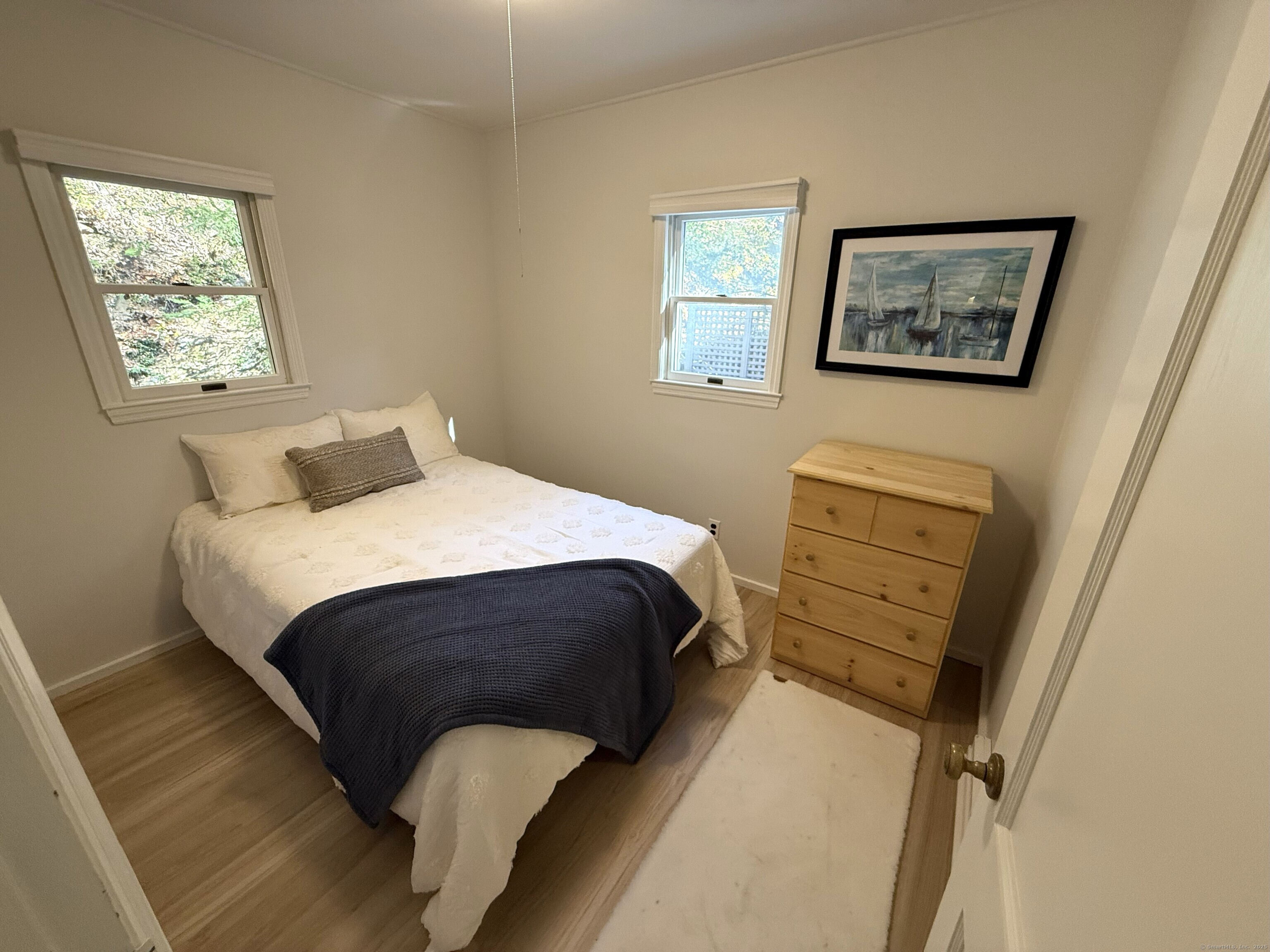 11 Bogus Hill Road New Fairfield, CT 06812 - Photo 8 of 13 a bedroom with a bed and a window