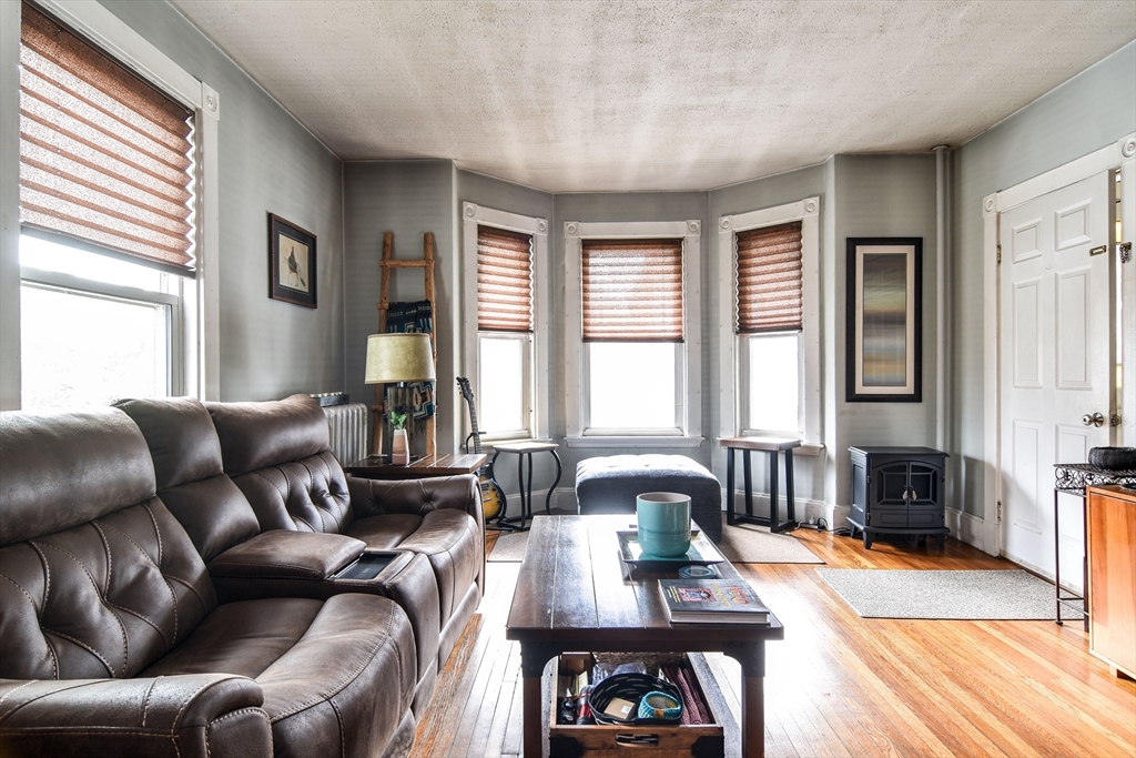 30 Winter Street Framingham, MA 01702 - Photo 3 of 23 a living room with furniture and a wooden floor