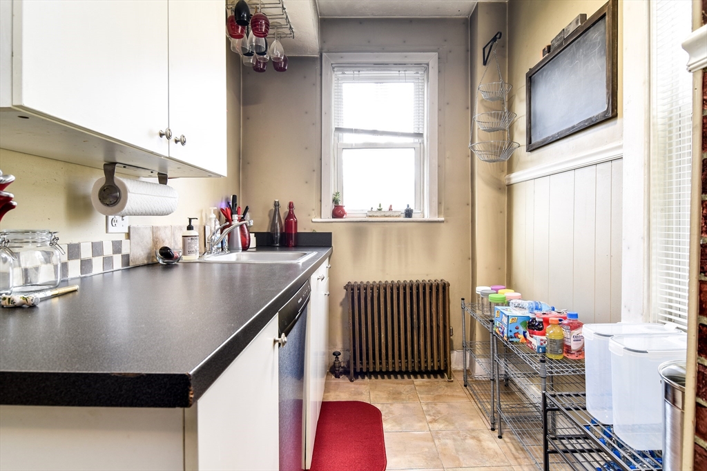 30 Winter Street Framingham, MA 01702 - Photo 6 of 23 a view of kitchen and dining room with windows