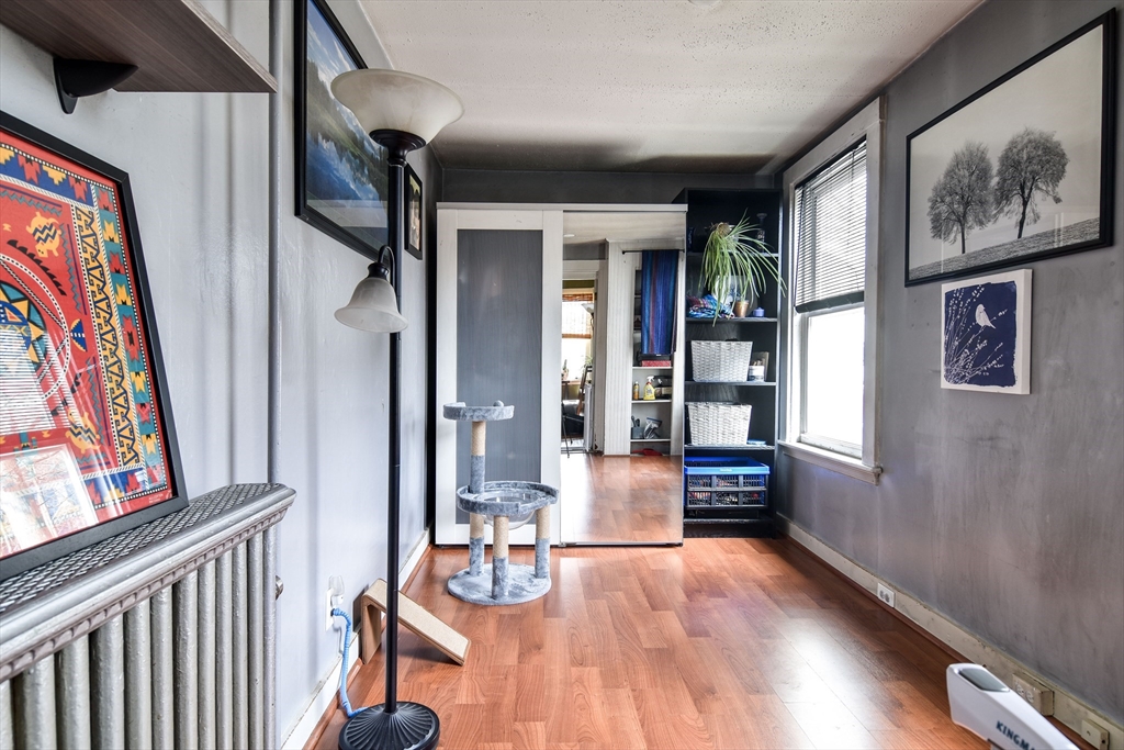30 Winter Street Framingham, MA 01702 - Photo 9 of 23 a view of a hallway with wooden floor and furniture