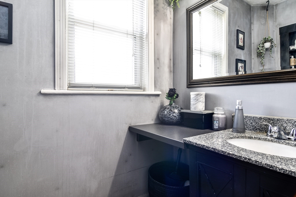 30 Winter Street Framingham, MA 01702 - Photo 10 of 23 a bathroom with a granite countertop sink and a window