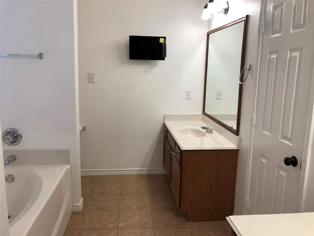 a bathroom with a sink a toilet and bathtub