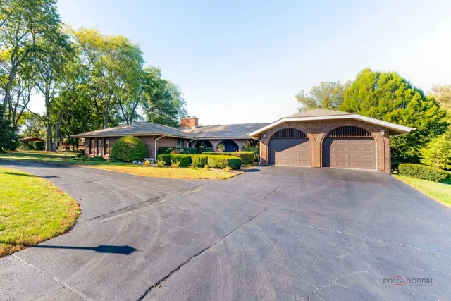 a house with swimming pool in front of it