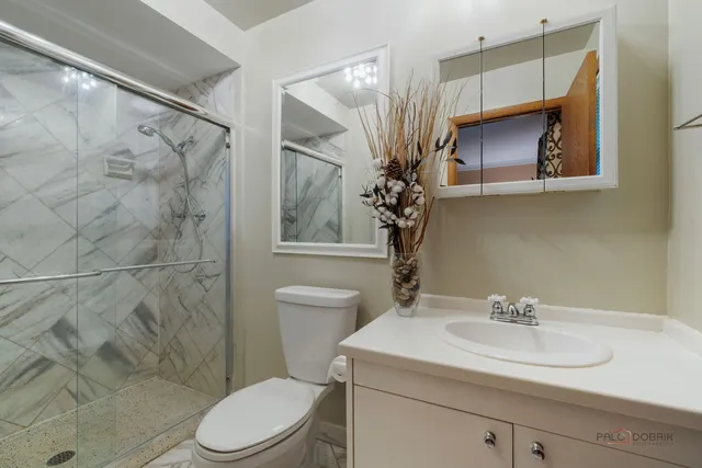 an outdoor sitting area with furniture and garden