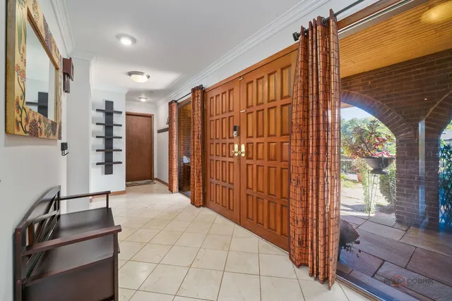 a large kitchen with stainless steel appliances granite countertop a sink and cabinets