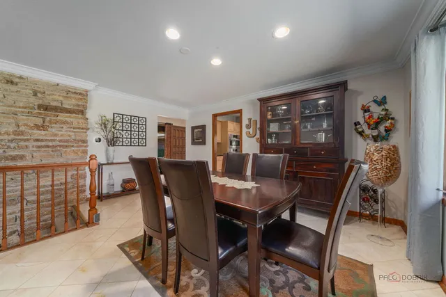 a kitchen with stainless steel appliances granite countertop a refrigerator sink and stove