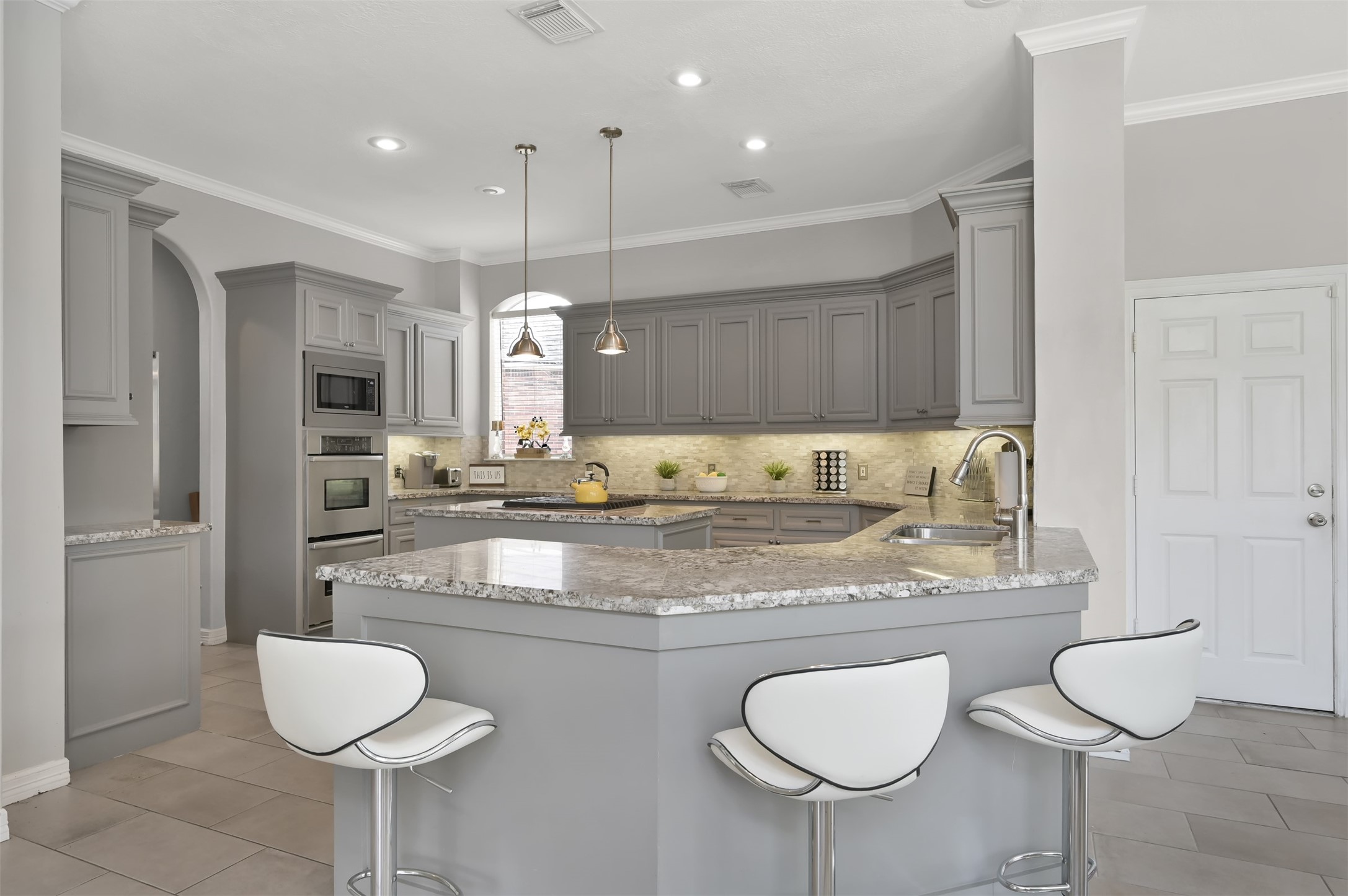 9706 Chipstead Court Spring, TX 77379 - Photo 18 of 44 I don't know about you, but I like having company while I'm cooking. Check out this spot for friends to hang out or for you to grab a quick bite when you're in a hurry.