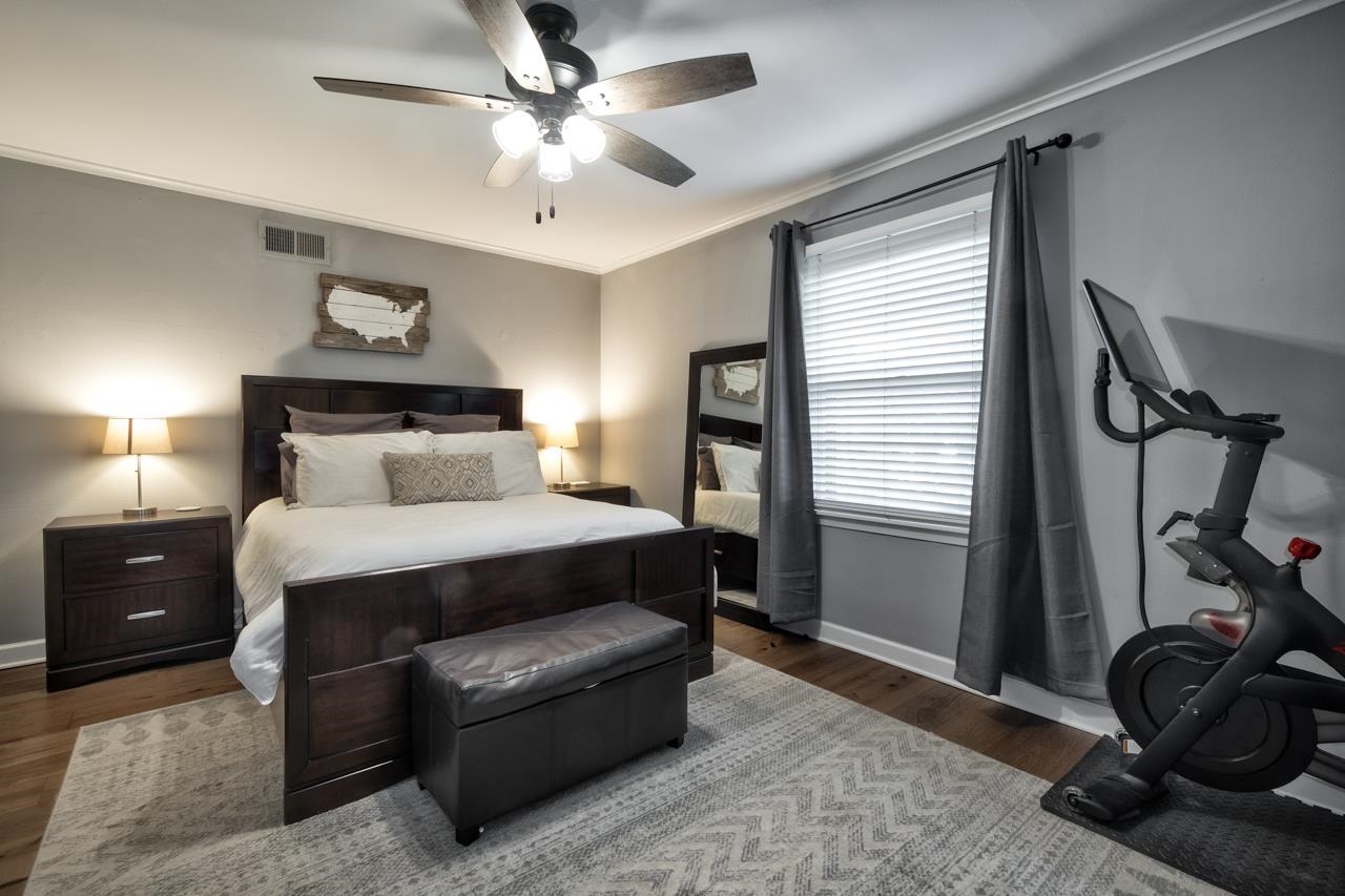 5135 Princeton Road Memphis, TN 38117 - Photo 18 of 24 a bedroom with a bed and a chandelier