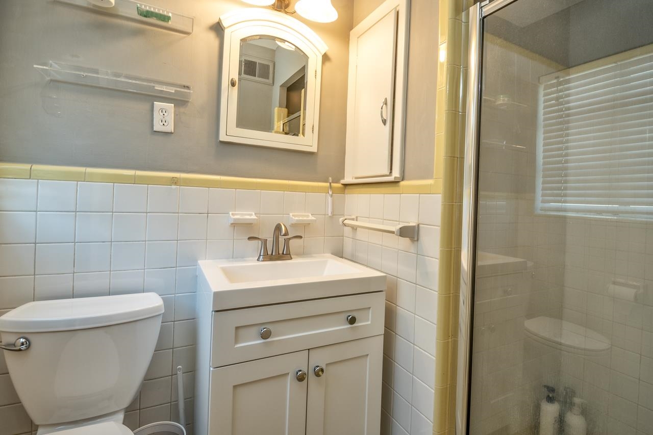 5135 Princeton Road Memphis, TN 38117 - Photo 19 of 24 a bathroom with a sink toilet and mirror