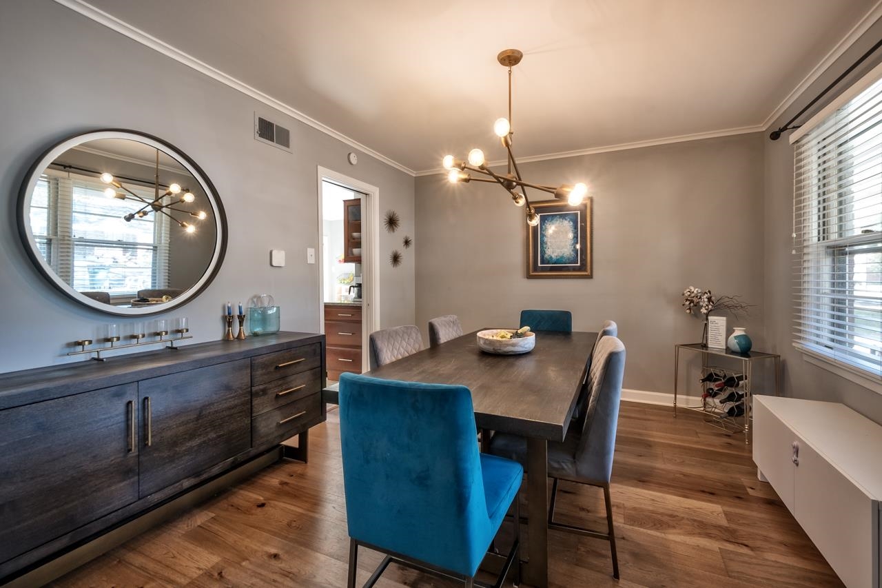 5135 Princeton Road Memphis, TN 38117 - Photo 8 of 24 a view of a dining room with furniture and a chandelier