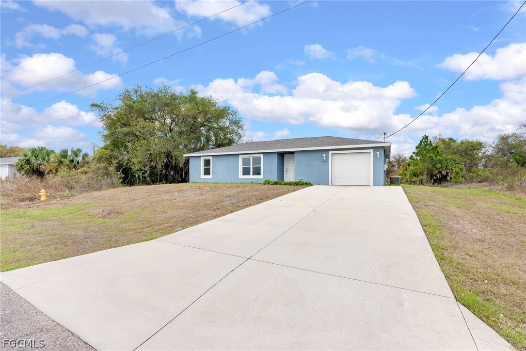 1405 Inwood Road LaBelle, FL 33935 - Photo 1 of 35 a view of house with outdoor space