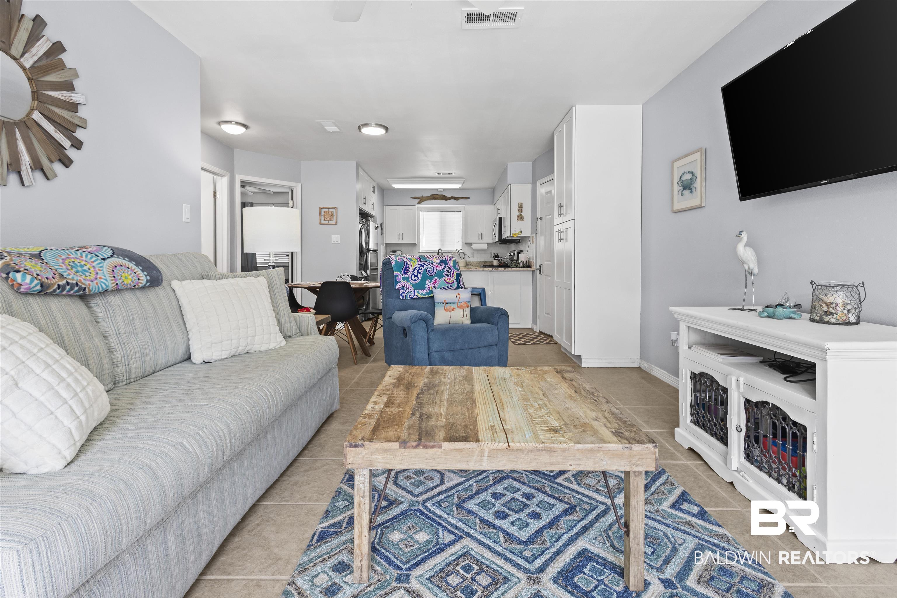 25925 Canal Road, Unit 207 Orange Beach, AL 36561 - Photo 13 of 42 View of tiled living room