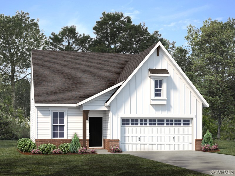 a view of a white house next to a yard