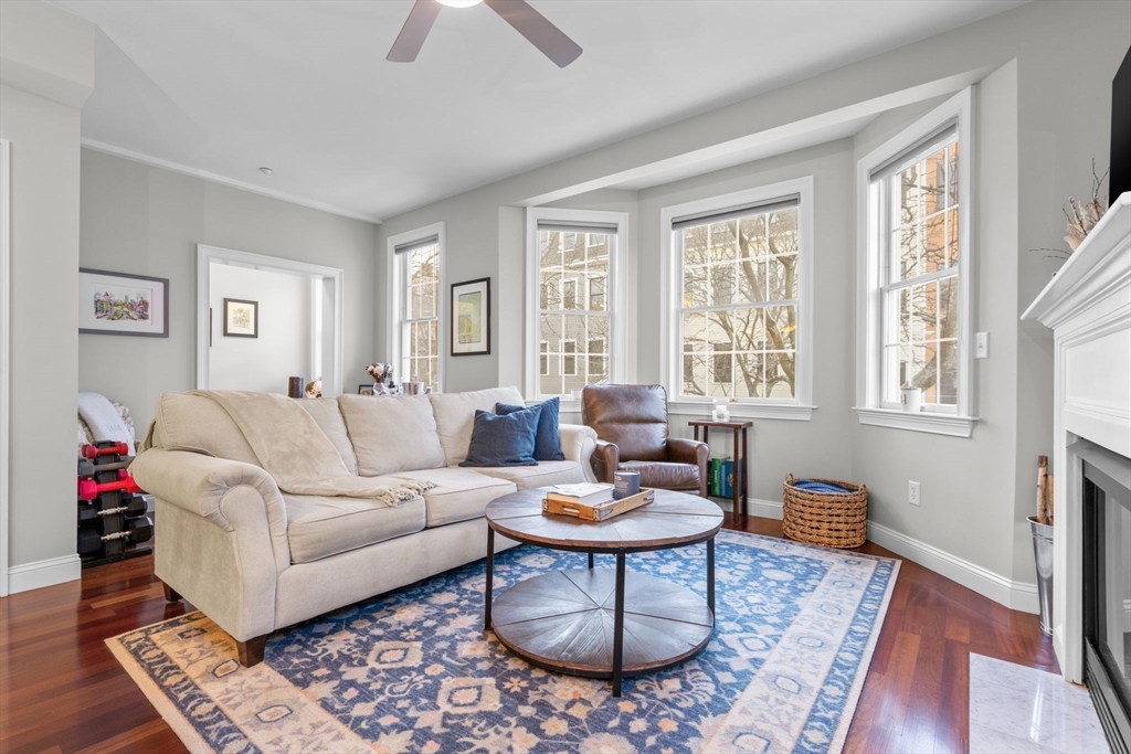 34 H Street, Unit 2L Boston, MA 02127 - Photo 5 of 20 a living room with furniture or couch and a window