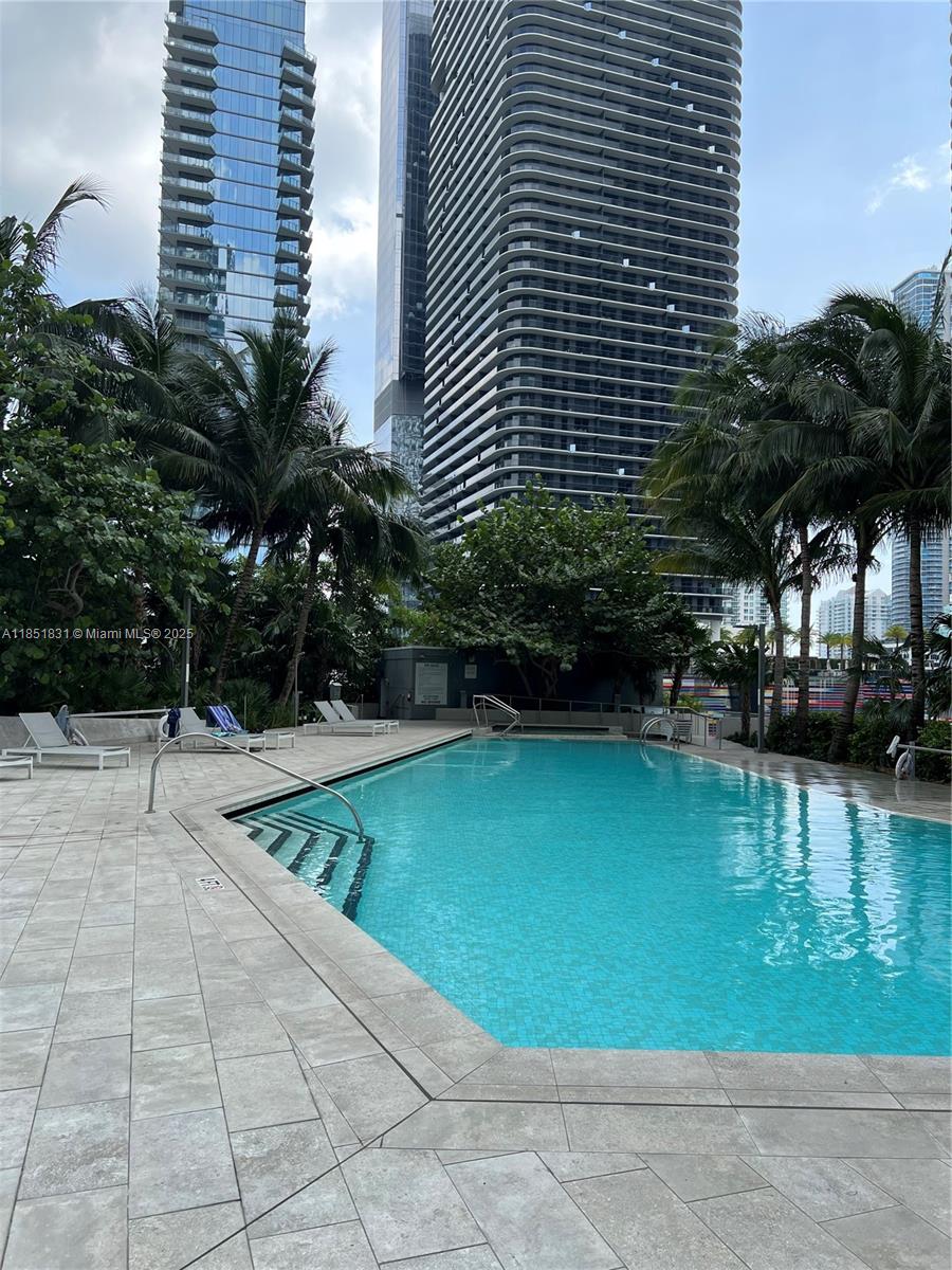 88 Southwest 7th Street, Unit 3007 Miami, FL 33130 - Photo 26 of 36 a view of swimming pool from a outdoor space