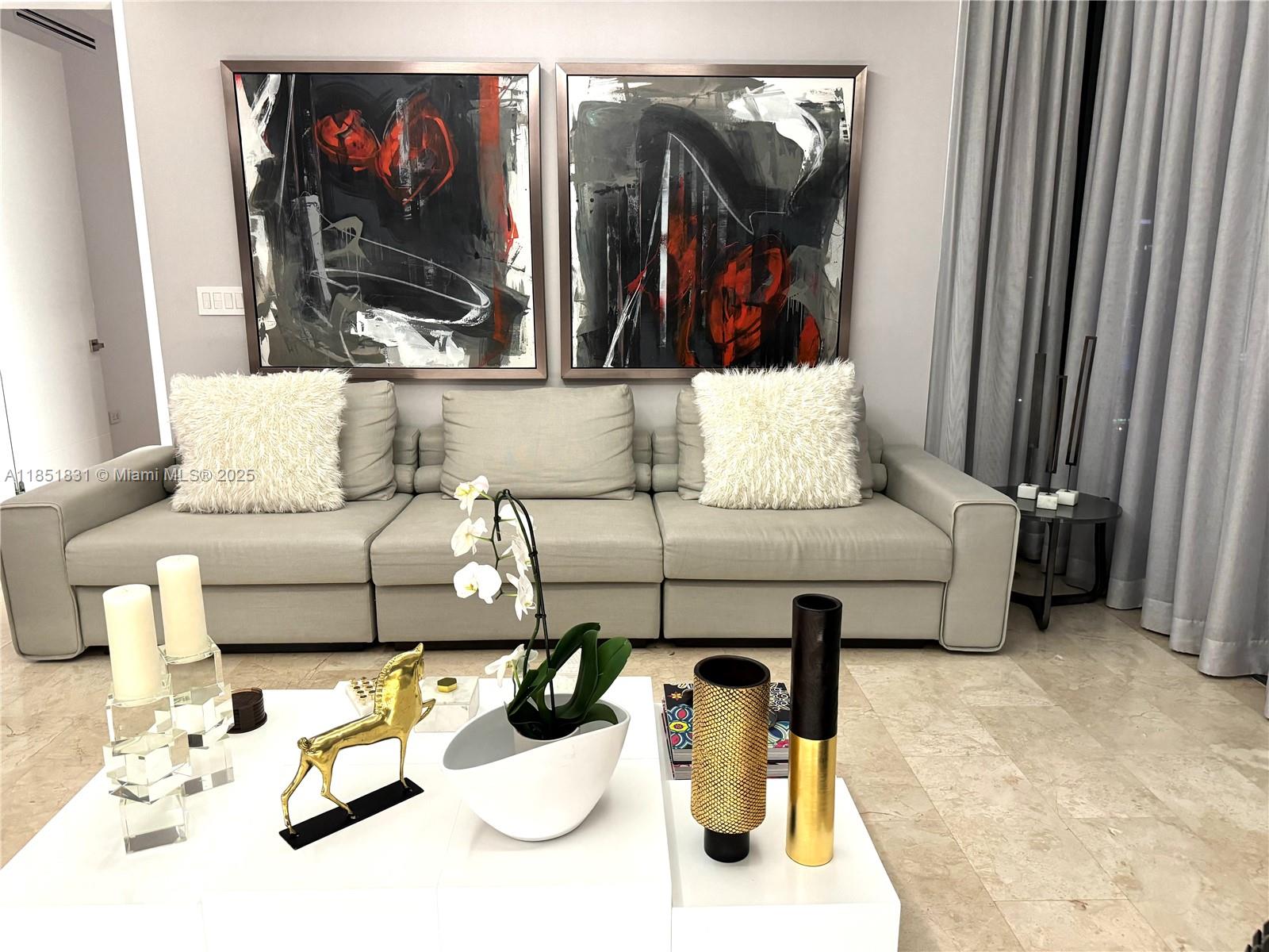 88 Southwest 7th Street, Unit 3007 Miami, FL 33130 - Photo 4 of 36 a living room with furniture and a mirror