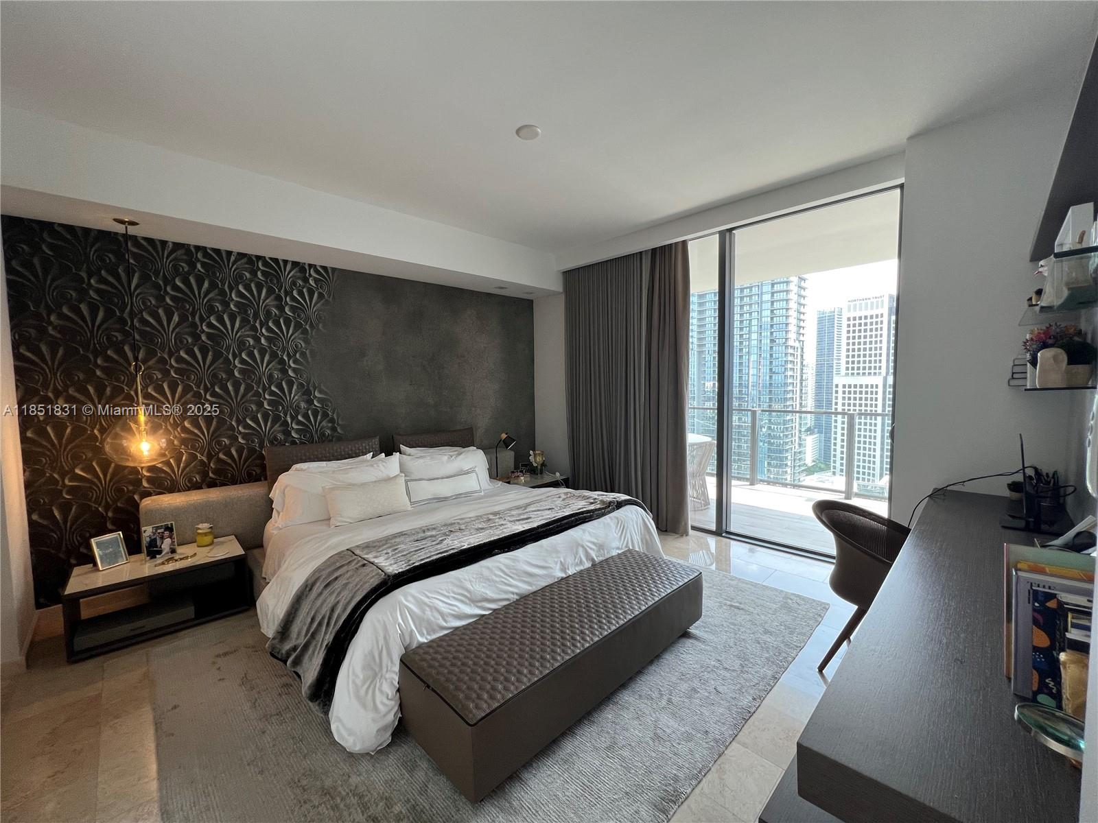 88 Southwest 7th Street, Unit 3007 Miami, FL 33130 - Photo 8 of 36 a bedroom with a bed and large windows