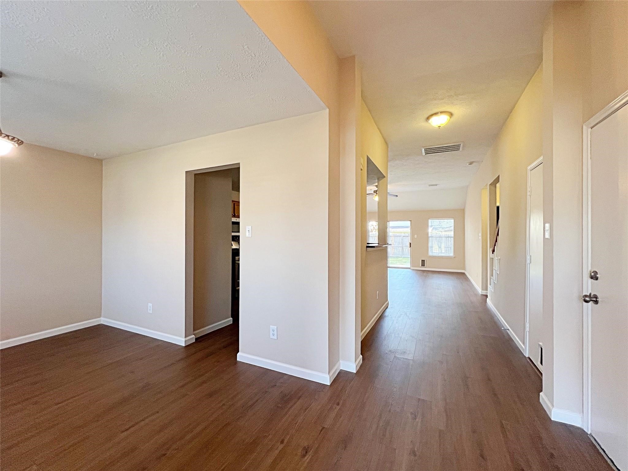16915 Lighthouse View Drive Friendswood, TX 77546 - Photo 4 of 44 a view of a hallway with wooden floor