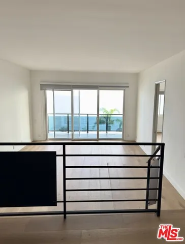 a view of entryway with a window and cabinet