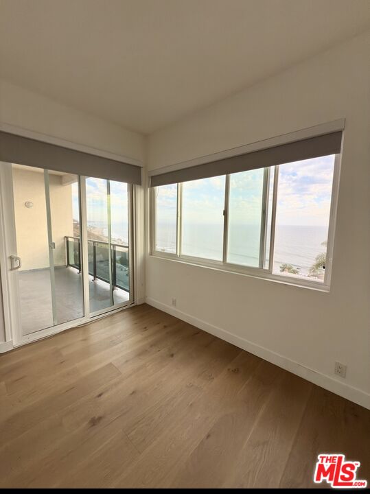 18069 Coastline Drive, Unit 9 Malibu, CA 90265 - Photo 12 of 22 a view of an empty room with a window