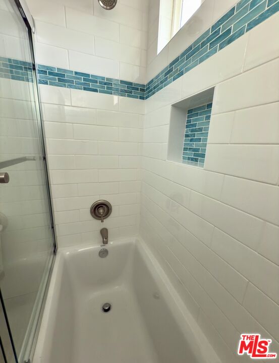 18069 Coastline Drive, Unit 9 Malibu, CA 90265 - Photo 16 of 22 a bathroom with a shower