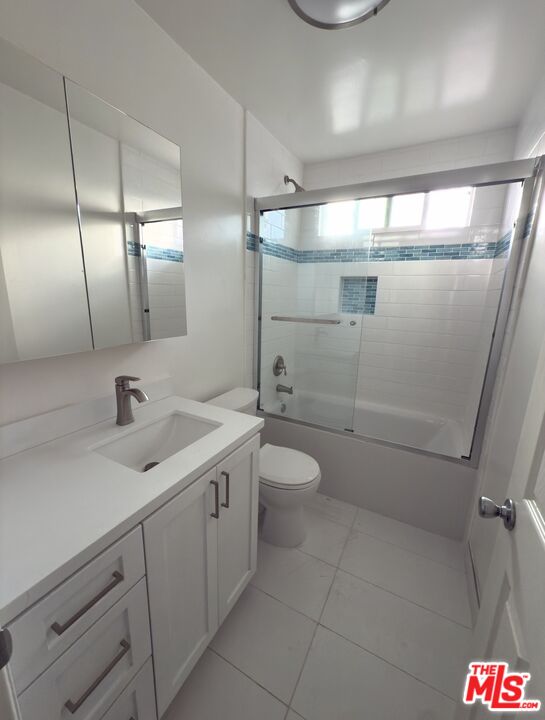 18069 Coastline Drive, Unit 9 Malibu, CA 90265 - Photo 17 of 22 a bathroom with a toilet sink and shower