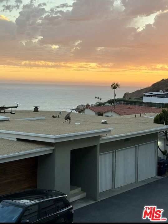 18069 Coastline Drive, Unit 9 Malibu, CA 90265 - Photo 2 of 22 a view of a terrace with mountain view