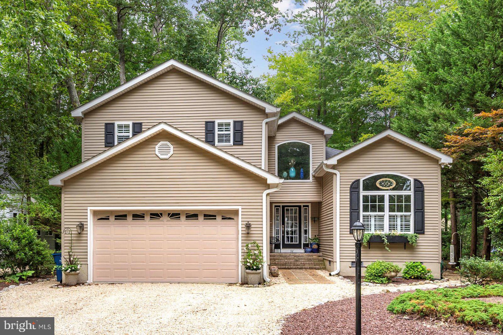 52 Sandyhook Road Ocean Pines, MD 21811 - Photo 1 of 131 a front view of a house with a yard and garage