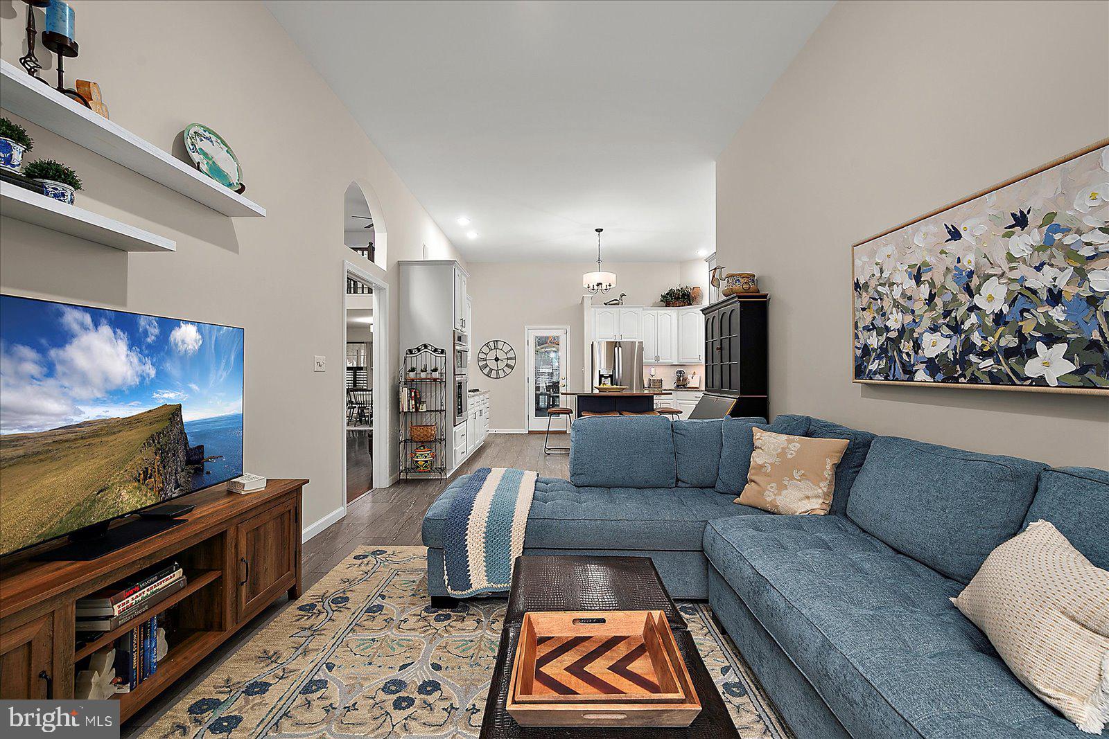 52 Sandyhook Road Ocean Pines, MD 21811 - Photo 15 of 131 a living room with furniture and a flat screen tv
