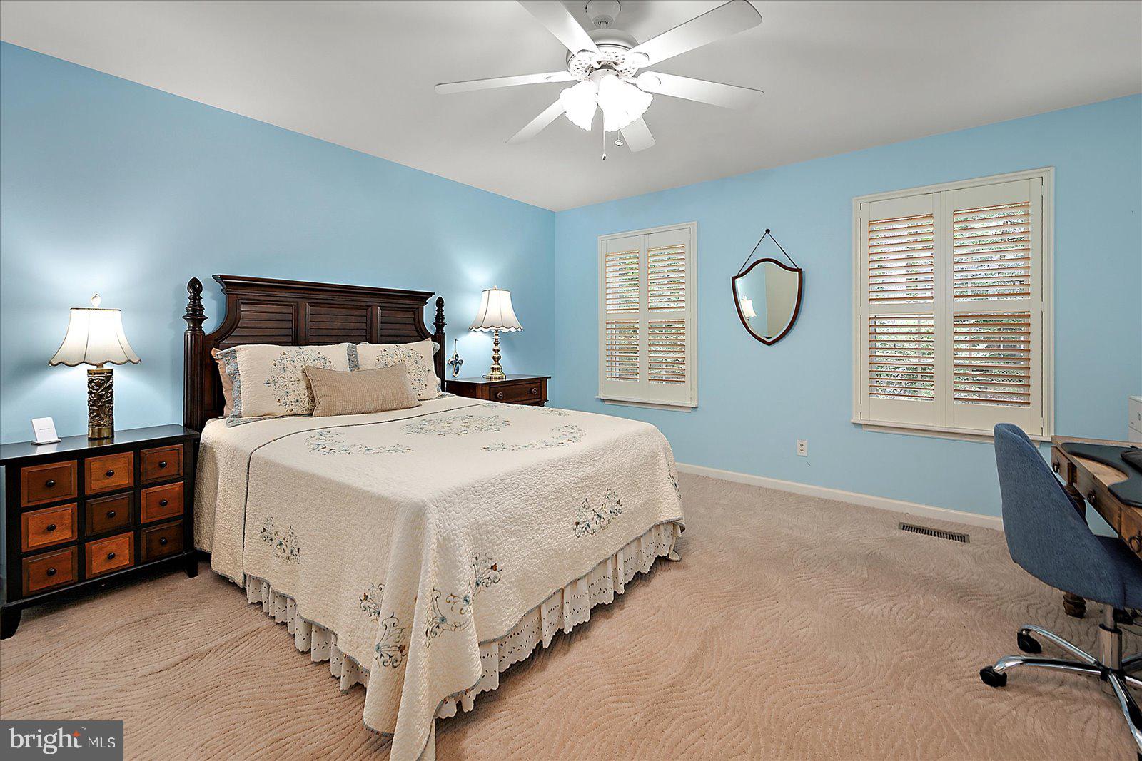 52 Sandyhook Road Ocean Pines, MD 21811 - Photo 40 of 131 a spacious bedroom with a bed and a chandelier