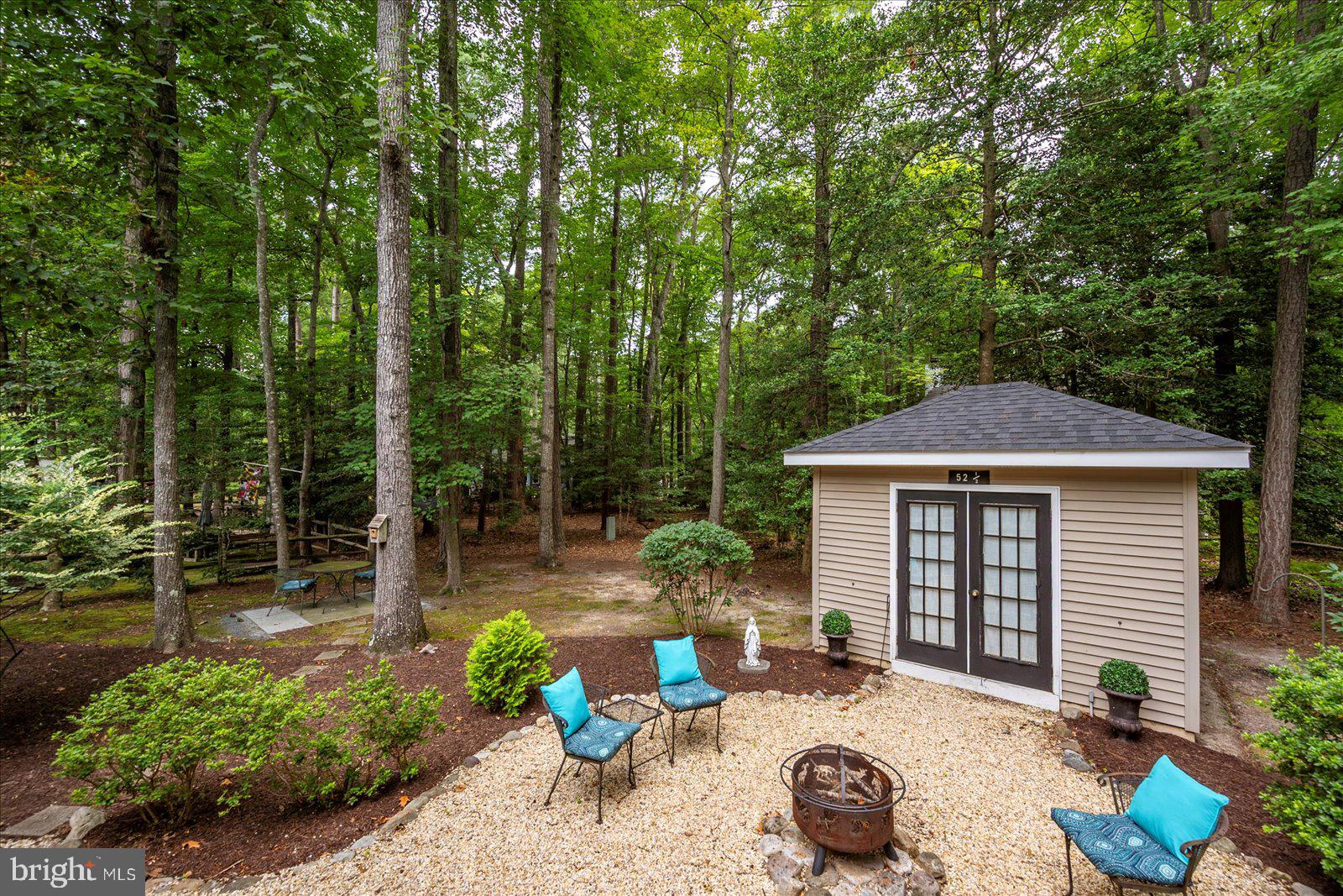 52 Sandyhook Road Ocean Pines, MD 21811 - Photo 68 of 131 a backyard of a house with seating space