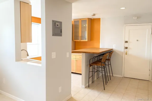 a view of kitchen with furniture and a window
