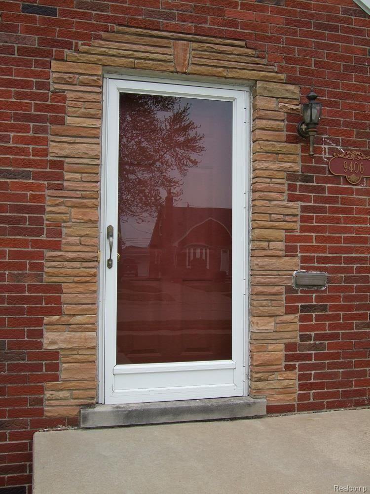 9406 Ruth Avenue Allen Park, MI 48101 - Photo 5 of 31 CUSTOM STEEL FRONT DOOR AND UPDATED STORM DOOR.
