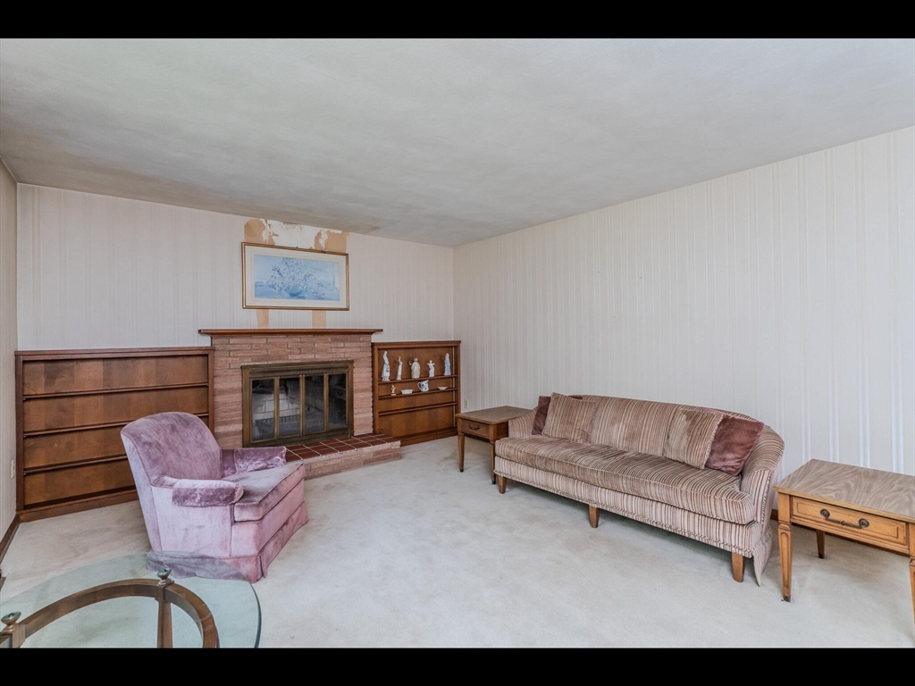 557 Maple Road Longmeadow, MA 01106 - Photo 11 of 31 a living room with furniture and a fireplace