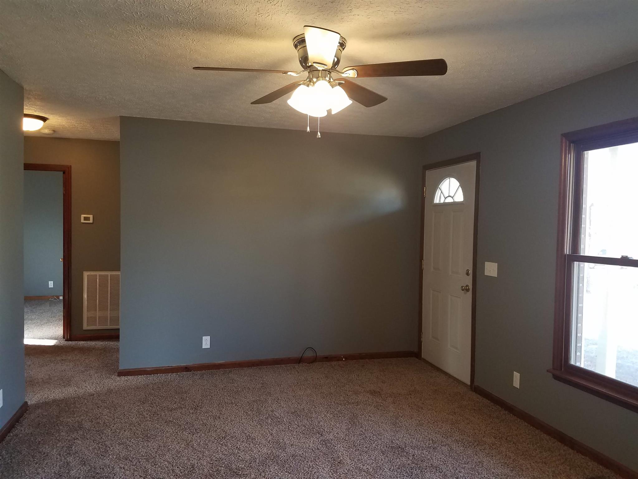 322 Pitt Lane Springfield, TN 37172 - Photo 3 of 5 an empty room with windows and fan