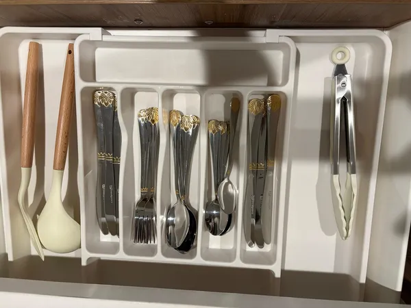 a view of a refrigerator with wooden floor