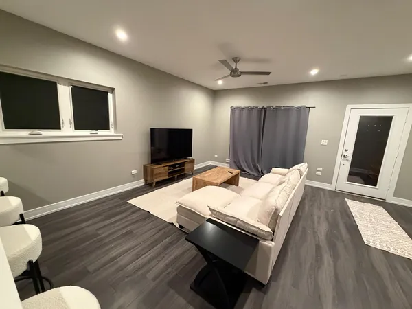 a bed room with a bed furniture and a flat screen tv