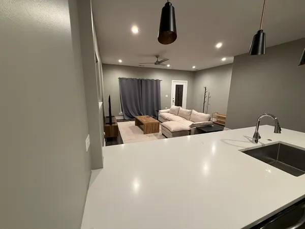 a large bathroom with a sink a large mirror and vanity