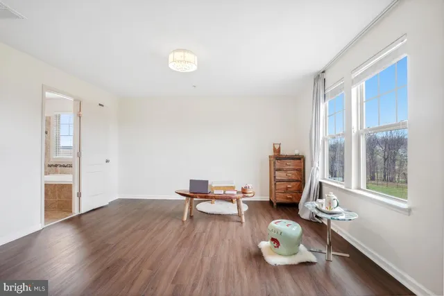 a large spacious bathroom with a tub sink shower and mirror