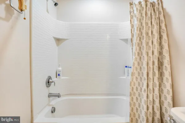 a bedroom with a bed and a table