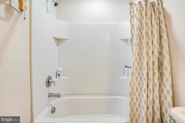 a bedroom with a bed and a table