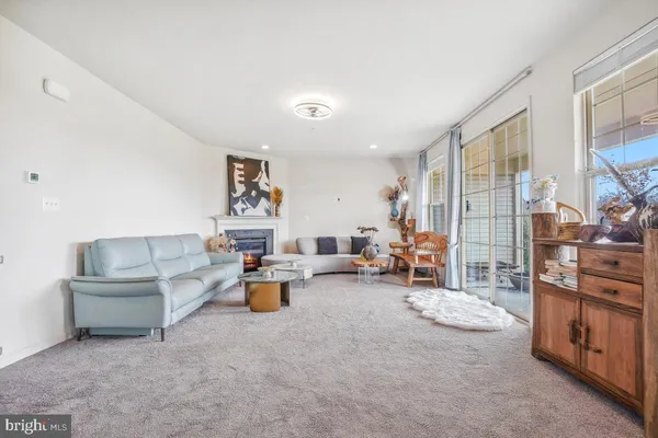 a living room with furniture and a table
