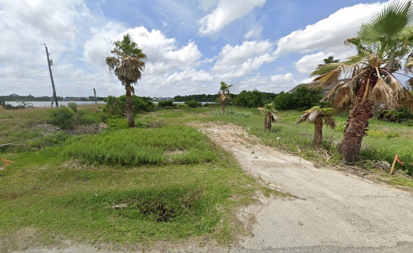 0 Todville Road Seabrook, TX 77586 - Photo 2 of 5 a view of a lake with a yard