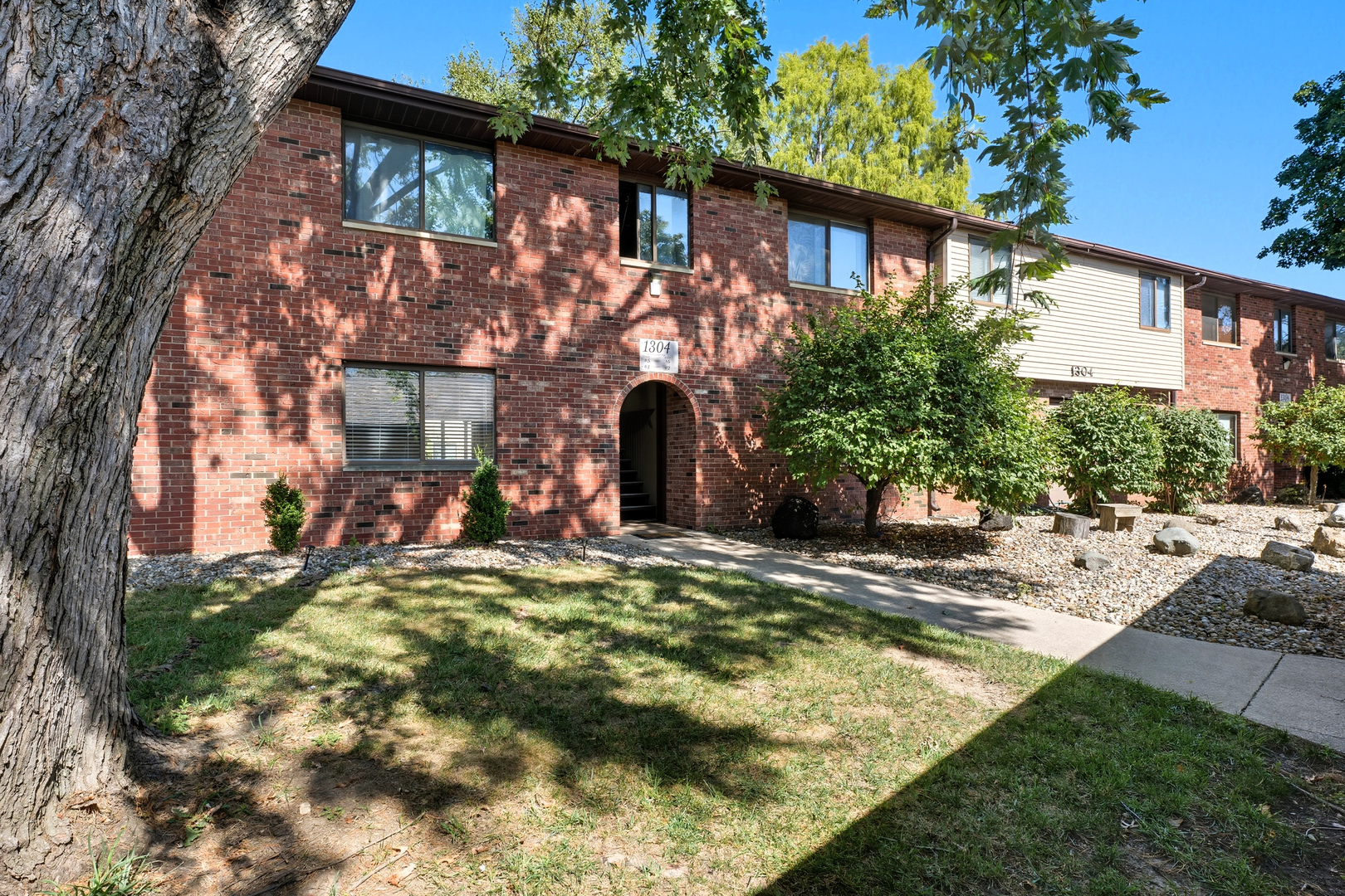 1304 Christopher Circle, Unit 1 Urbana, IL 61802 - Photo 1 of 18 front view of a house with a yard