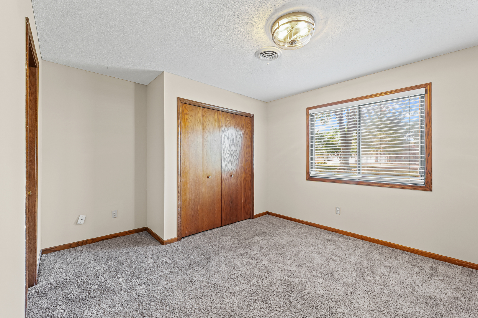 1304 Christopher Circle, Unit 1 Urbana, IL 61802 - Photo 11 of 18 a view of an empty room with a window