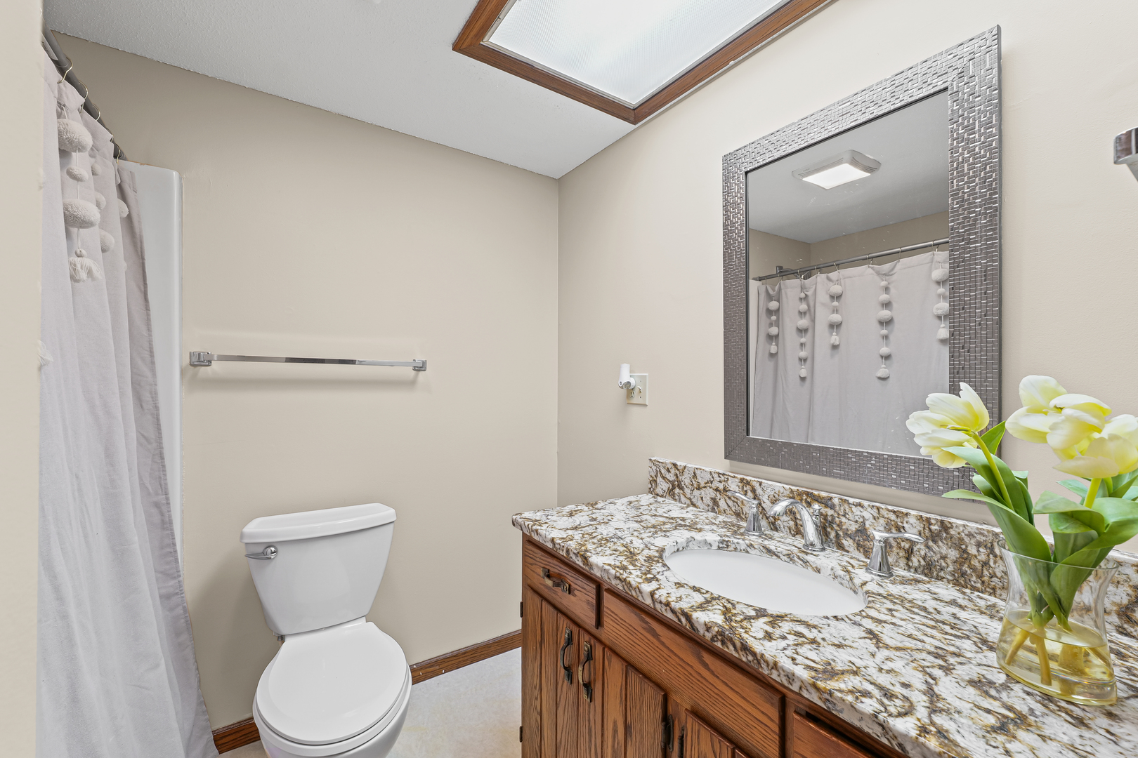 1304 Christopher Circle, Unit 1 Urbana, IL 61802 - Photo 8 of 18 a bathroom with a granite countertop sink toilet and shower