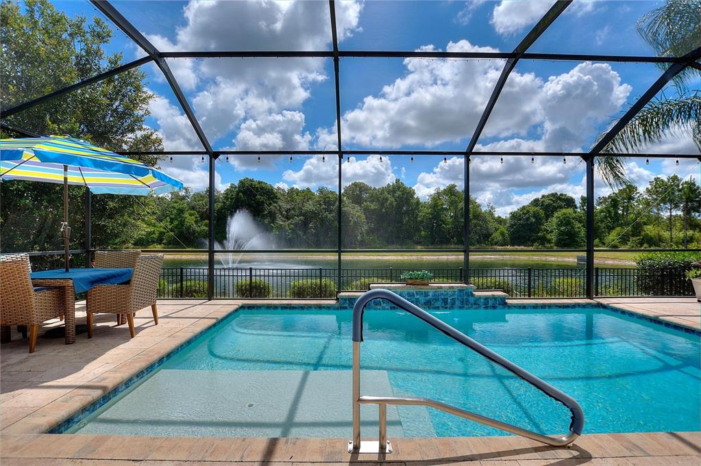 1089 Blackwolf Run Road Davenport, FL 33896 - Photo 2 of 82 a view of a swimming pool with a patio and a backyard