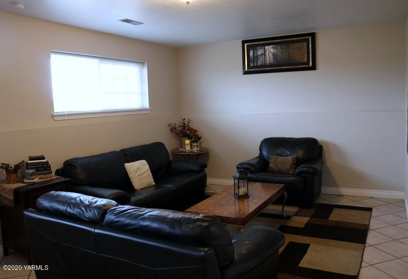 2491 Lateral 1 Road Wapato, WA 98951 - Photo 11 of 26 a living room with furniture and a window