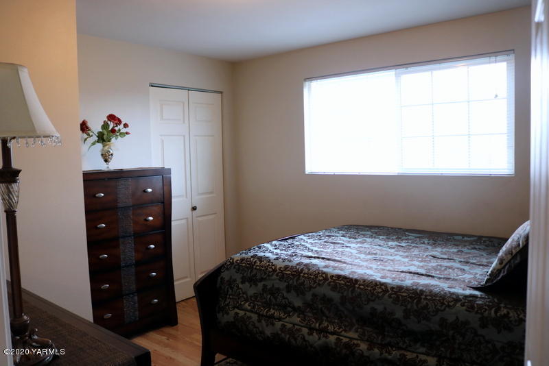 2491 Lateral 1 Road Wapato, WA 98951 - Photo 19 of 26 a bedroom with a bed and a window
